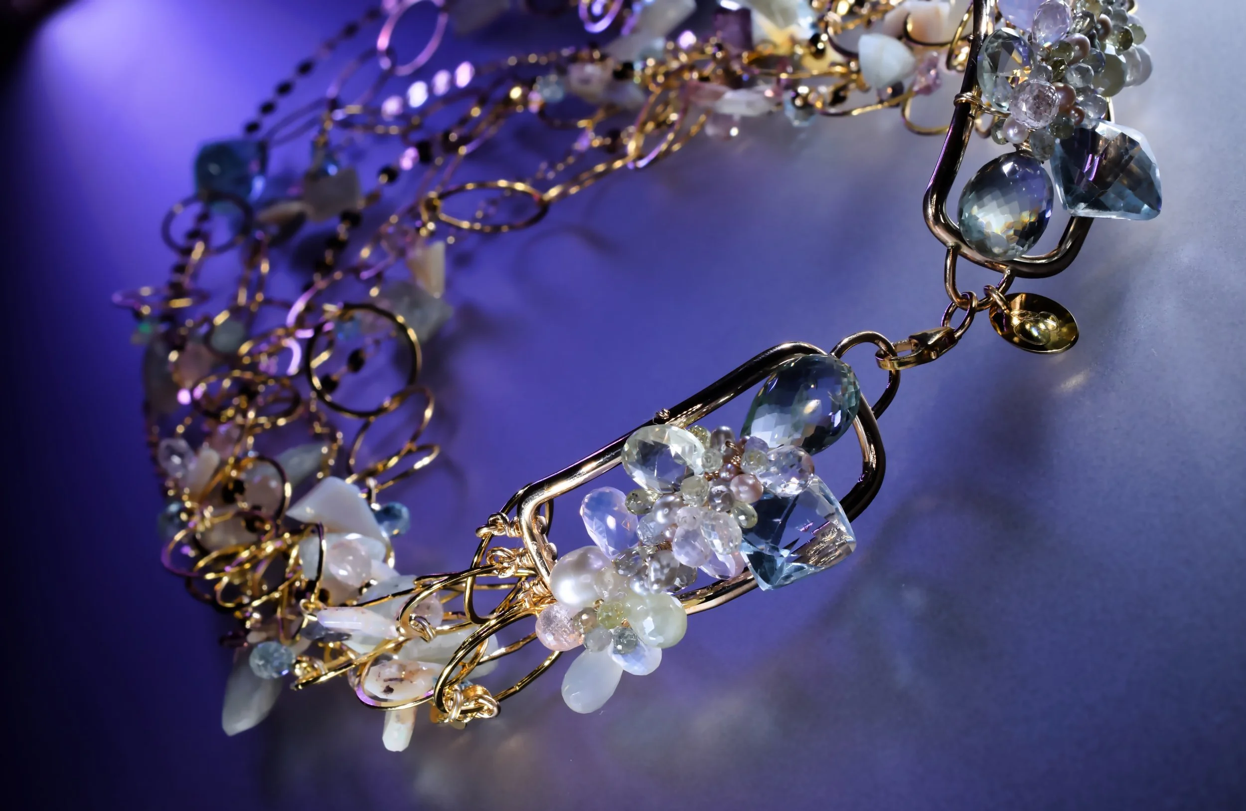 pastel gemstones in a necklace clasp detail