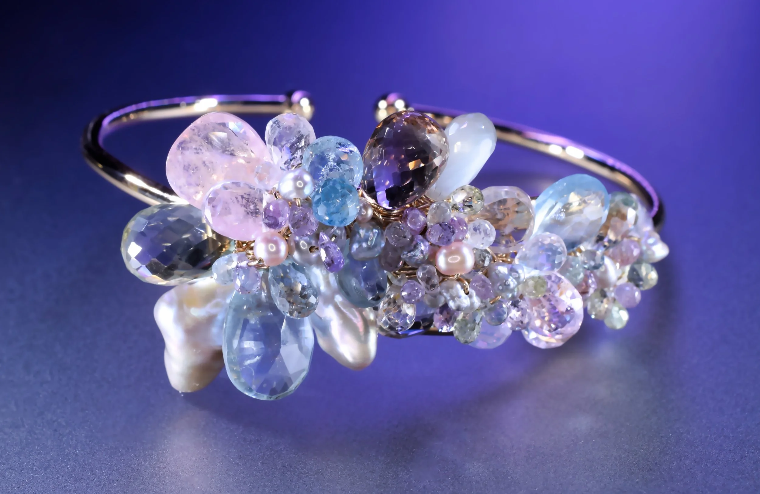 Pastel gemstone cuff bracelet with aquamarine, green amethyst and Akoya pearls by artist Andrea Li