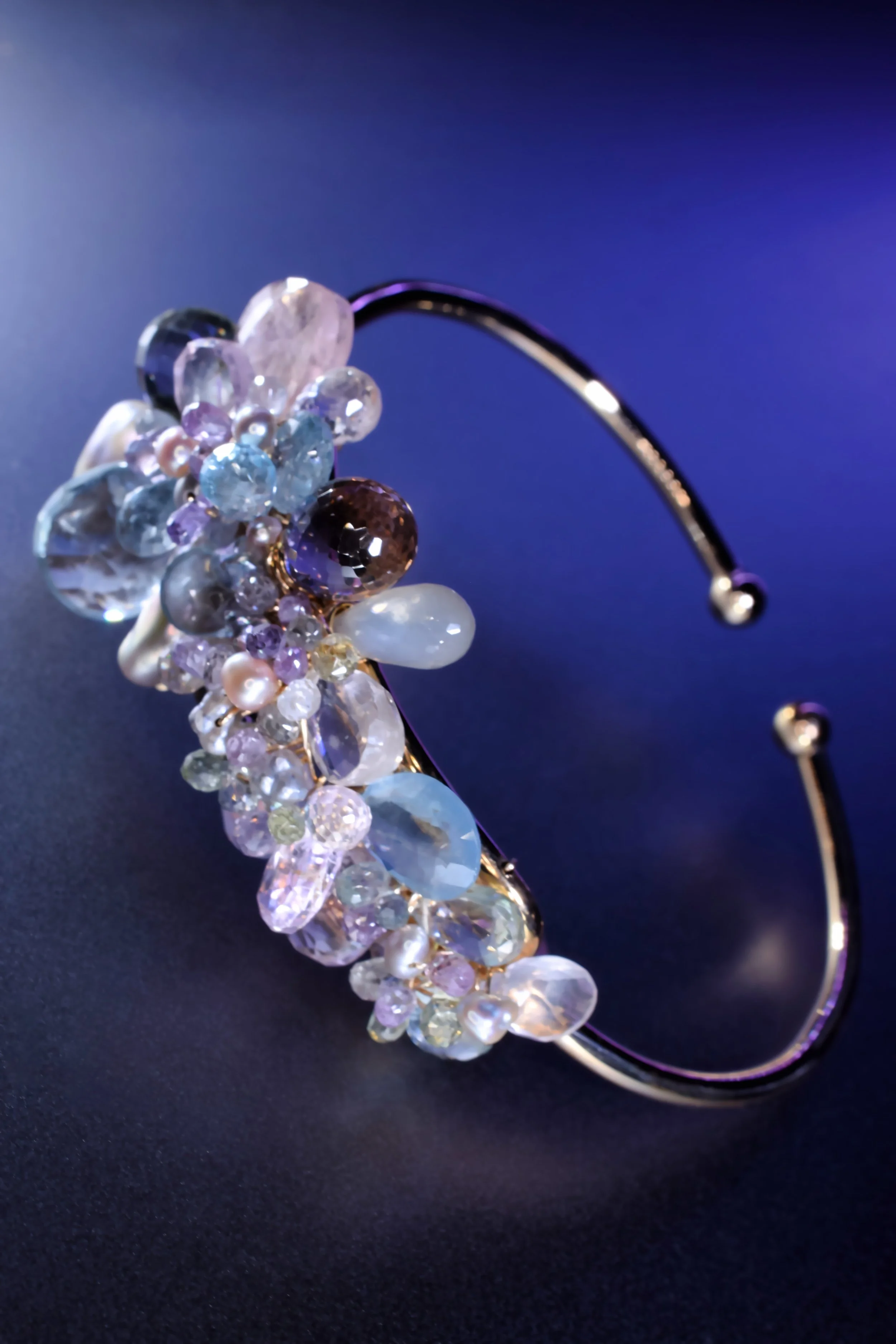 Handcrafted gemstone cuff in gold-filled wire with sculptural spring cluster