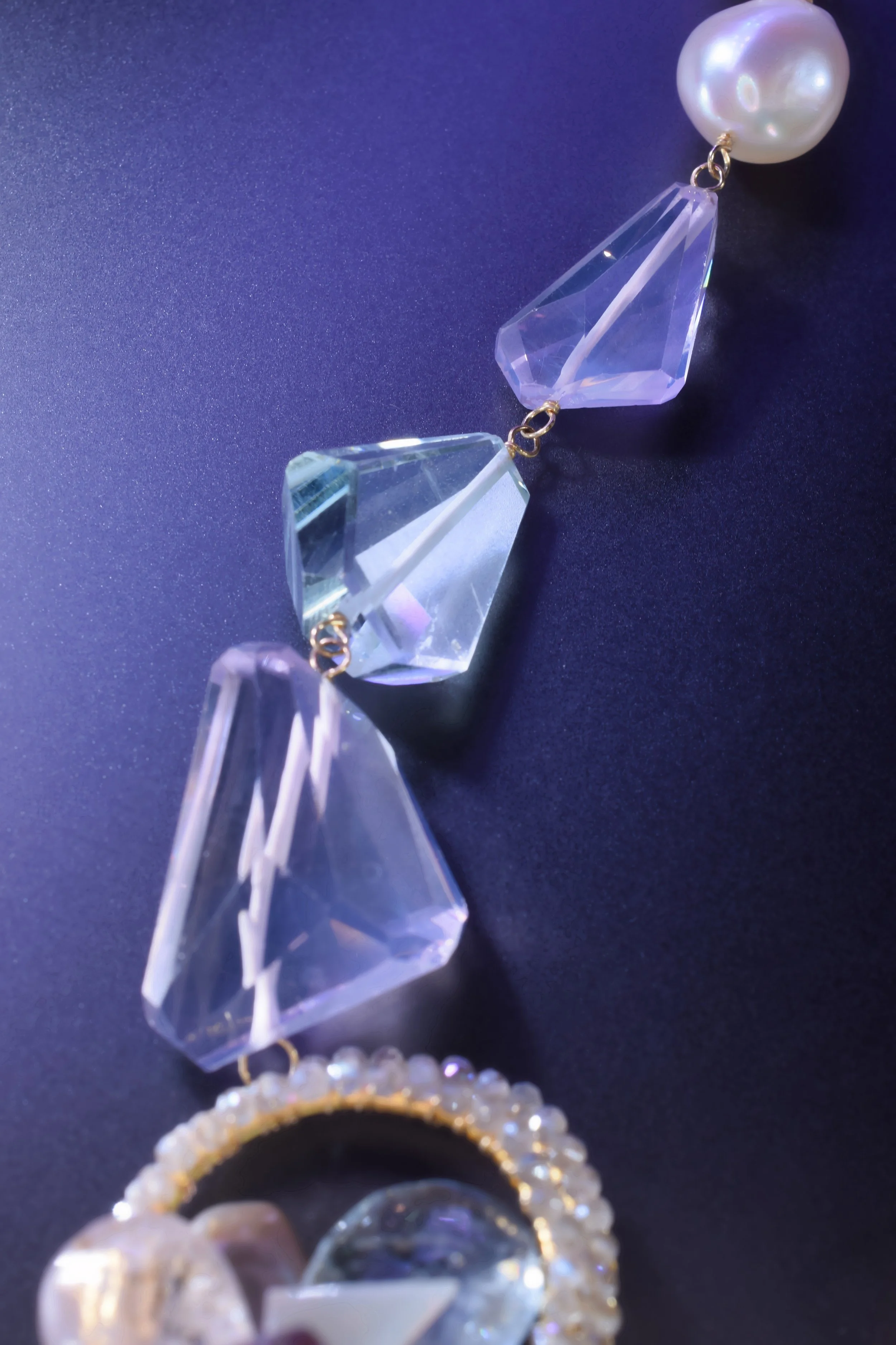 close up details of pastel gemstones of a necklace chain