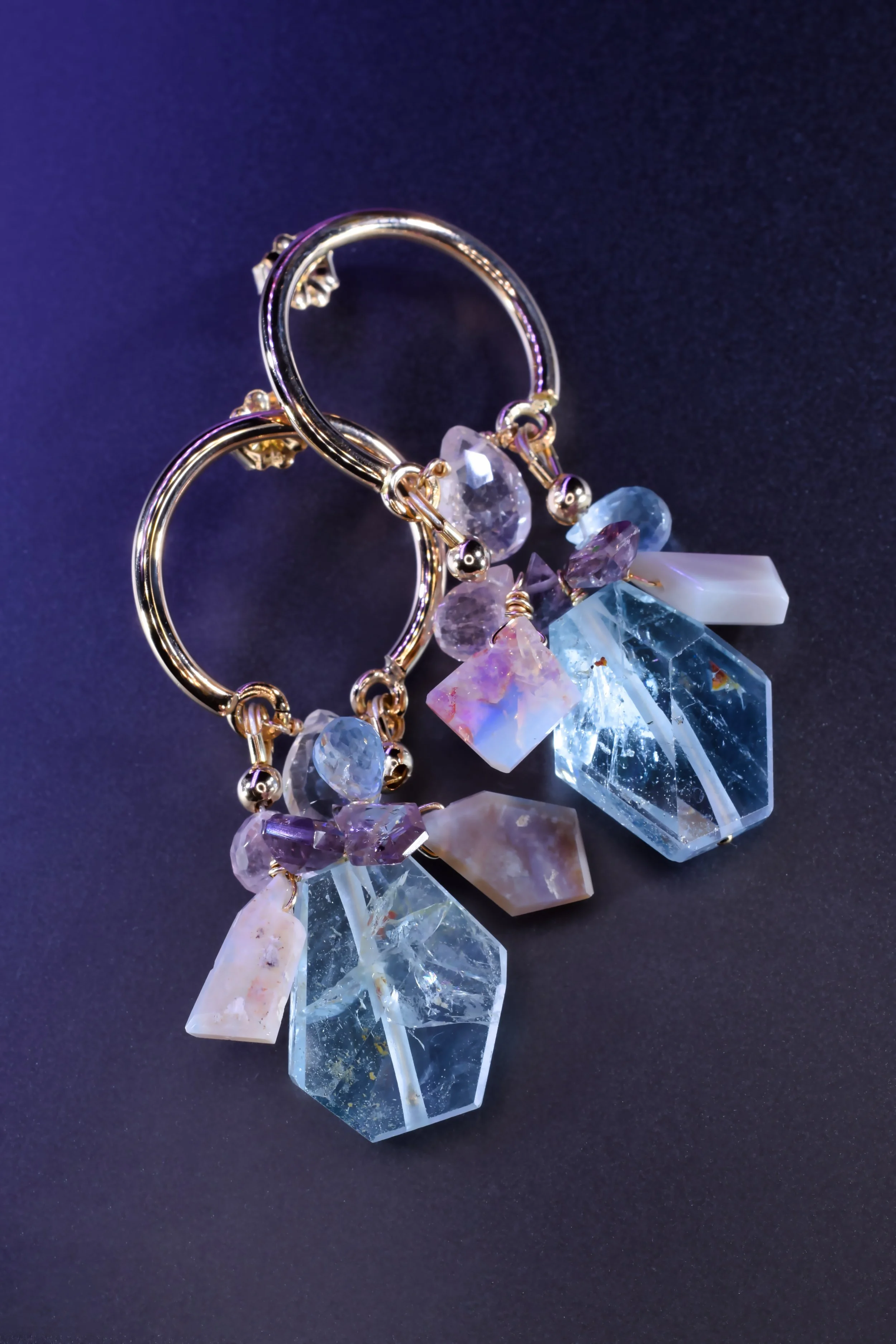 Pastel gemstone dangle hoop earrings with aquamarine, Kunzite, and Australian opal by jewelry designer Andrea Li