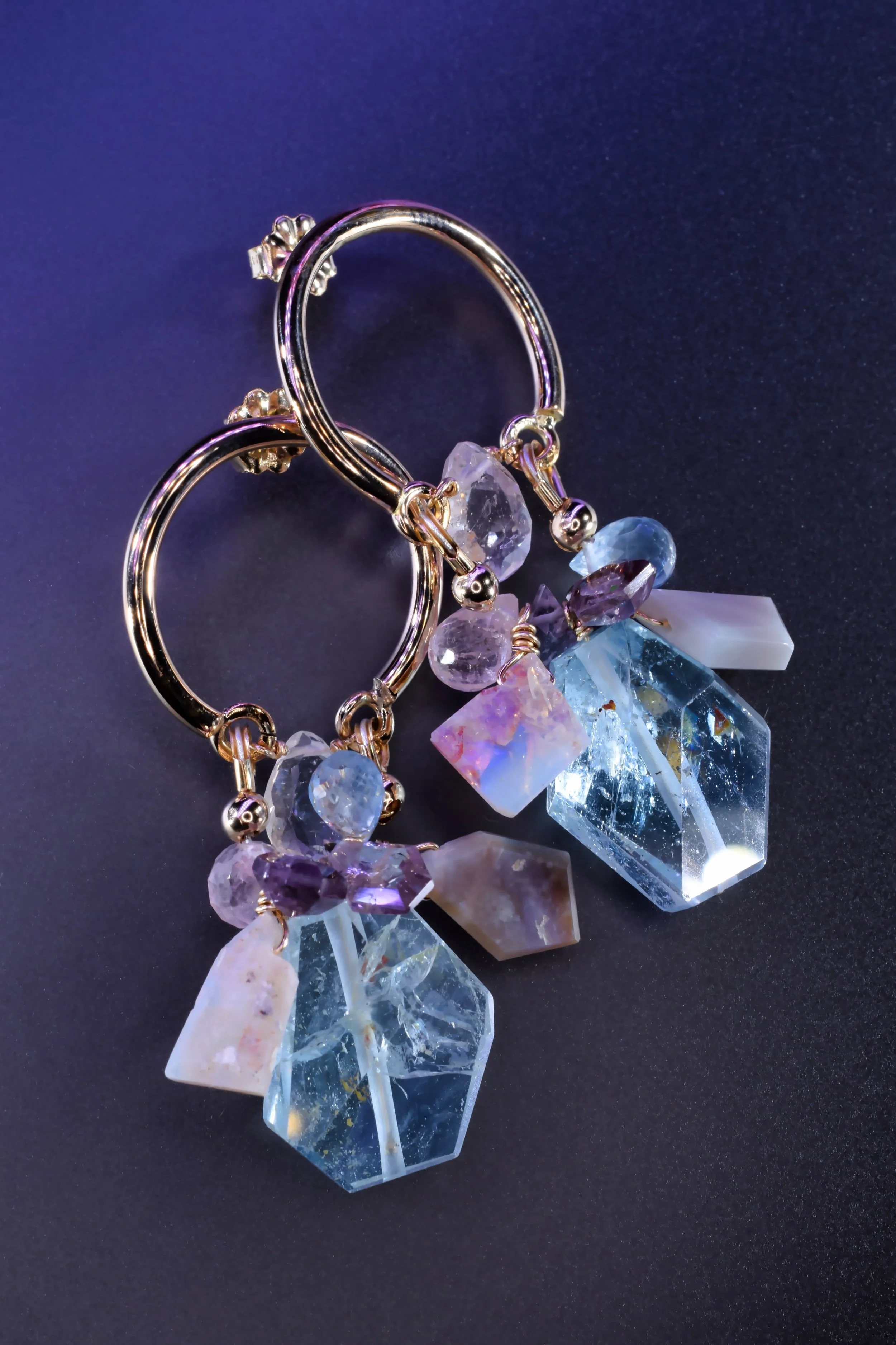 Pastel gemstone dangle hoop earrings with aquamarine, Kunzite, and Australian opal by jewelry designer Andrea Li