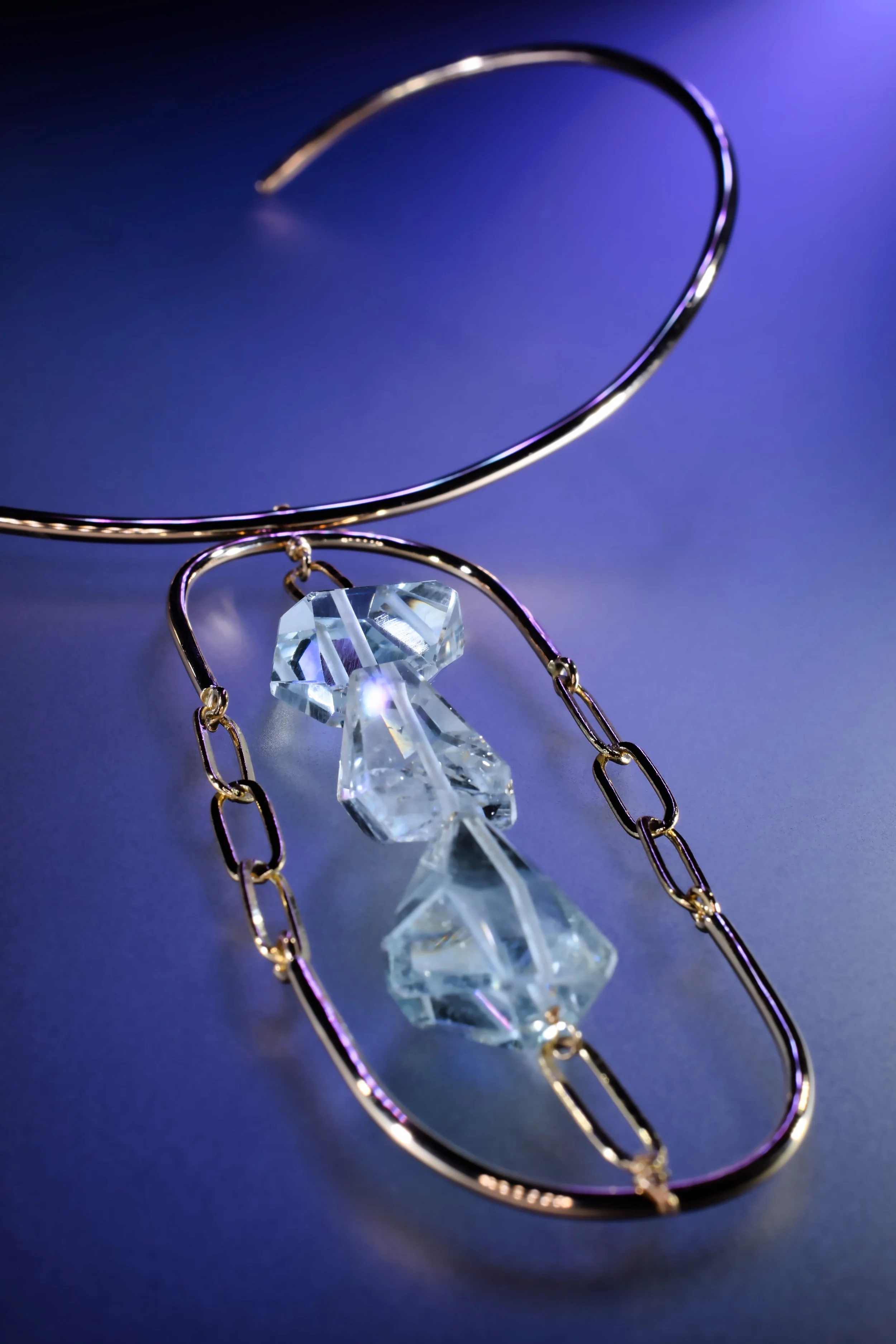 gold choker necklace with blue topaz gemstones and chains