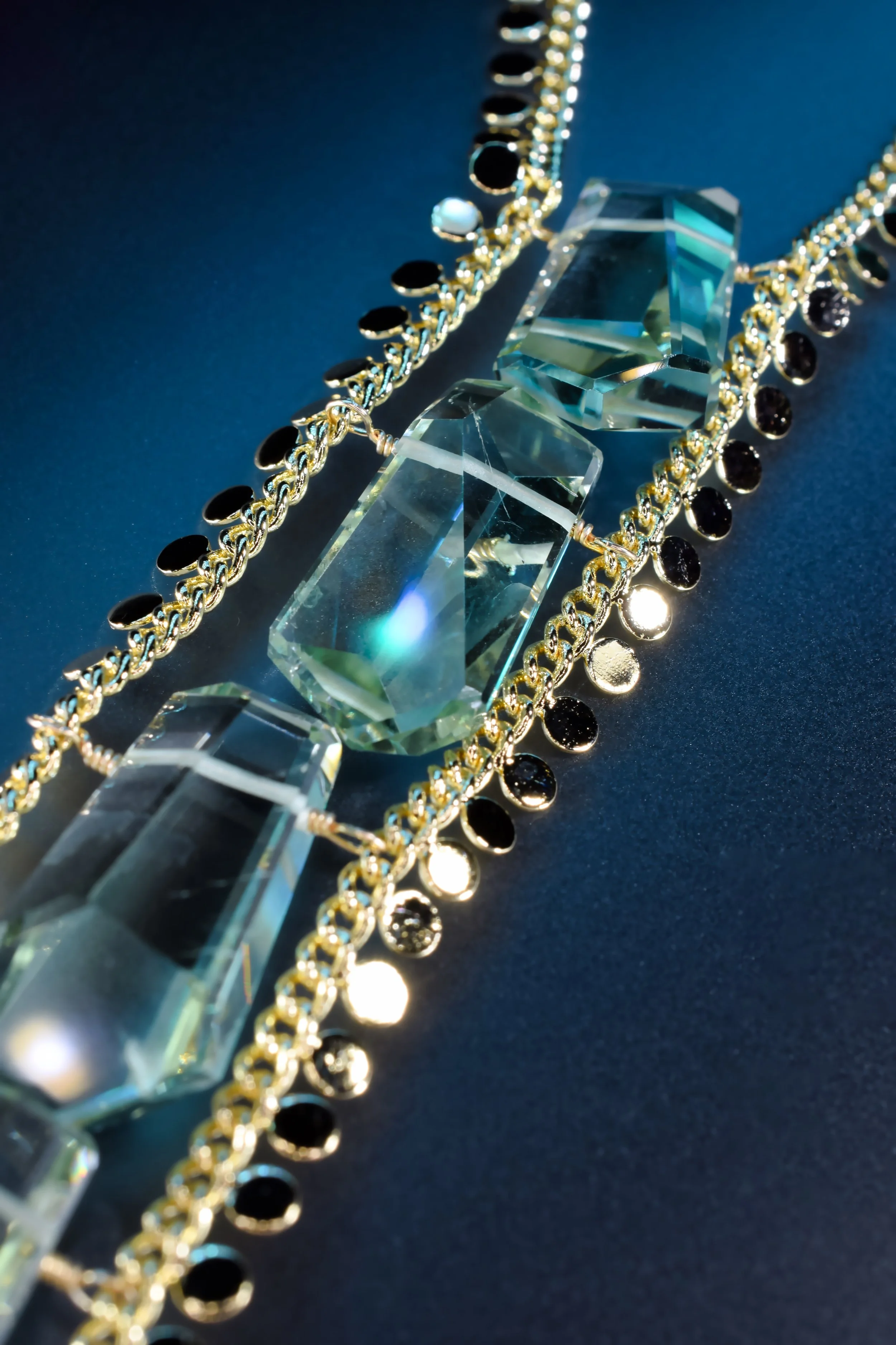 Green amethyst pendant on gold chain by jewelry designer