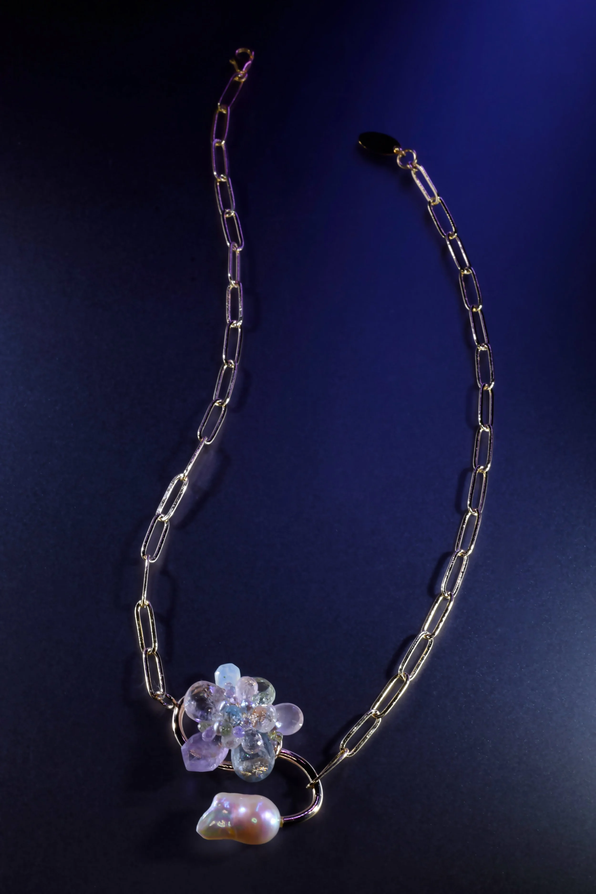 Gold paperclip chain necklace featuring pastel gemstone cluster, baroque pearl, and handmade pendant by jewelry artist Andrea Li