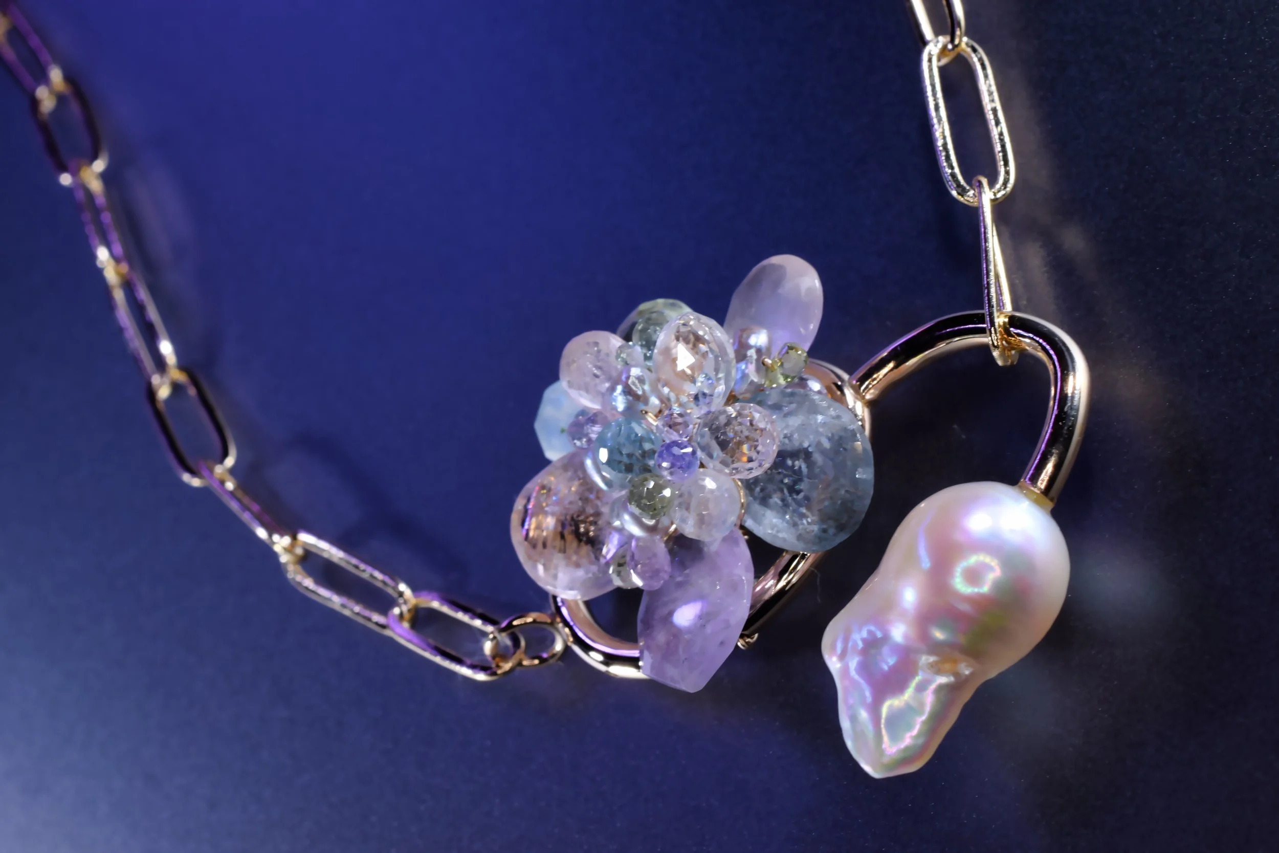 pastel gemstone pendant with a Baroque pearl hook necklace
