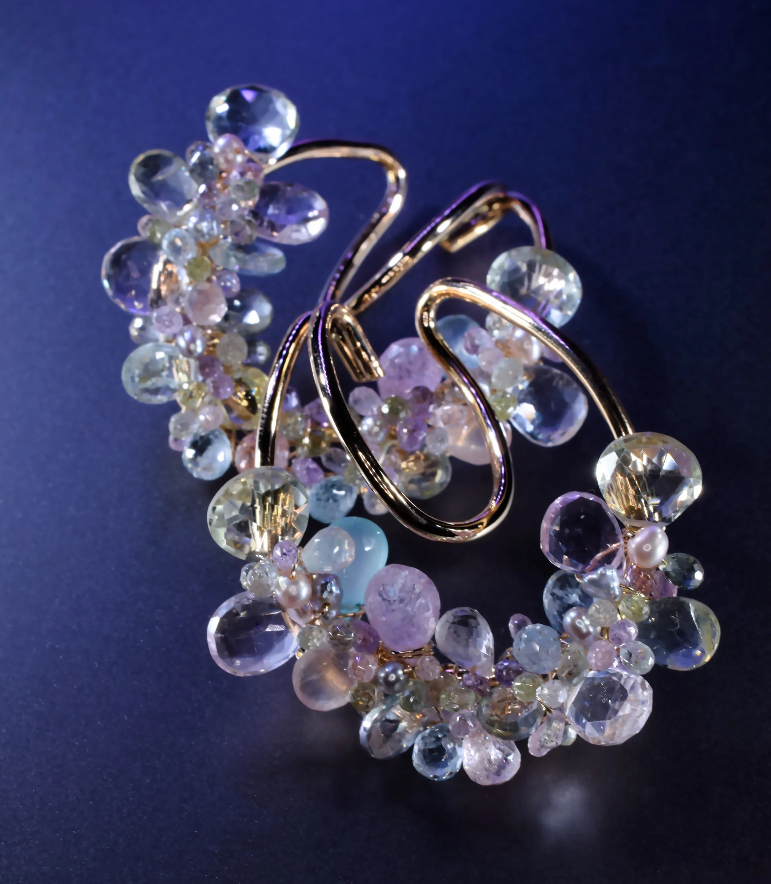 Andrea Li pastel gemstone ear cuffs with yellow aquamarine, green topaz, and Peruvian opal on gold wire