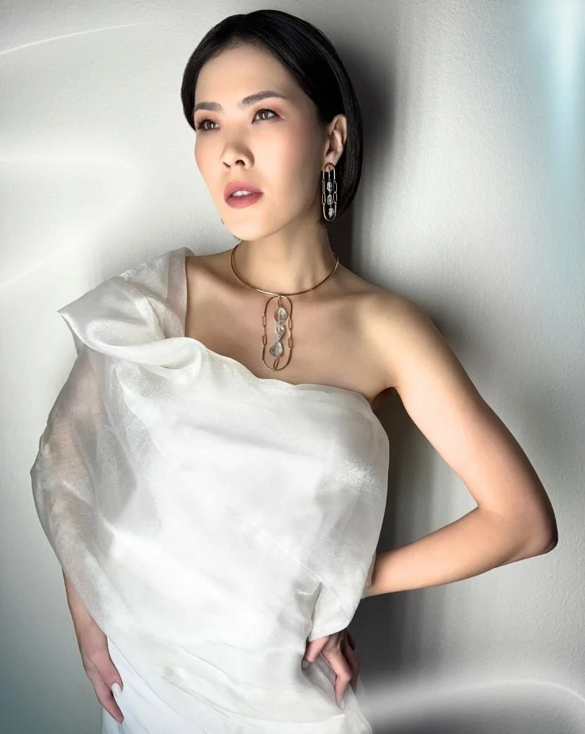 model wearing aquamarine choker and earrings.jpg