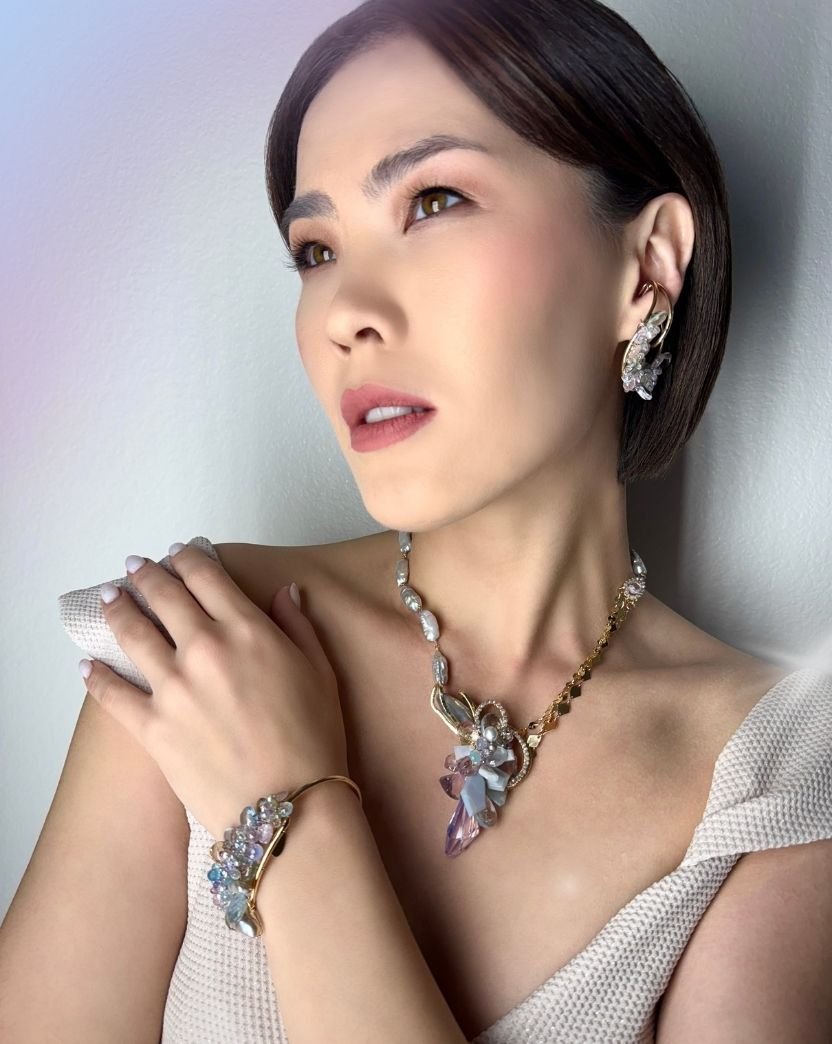 model wearing pastel gemstone necklace bracelet  and ear cuff.jpg