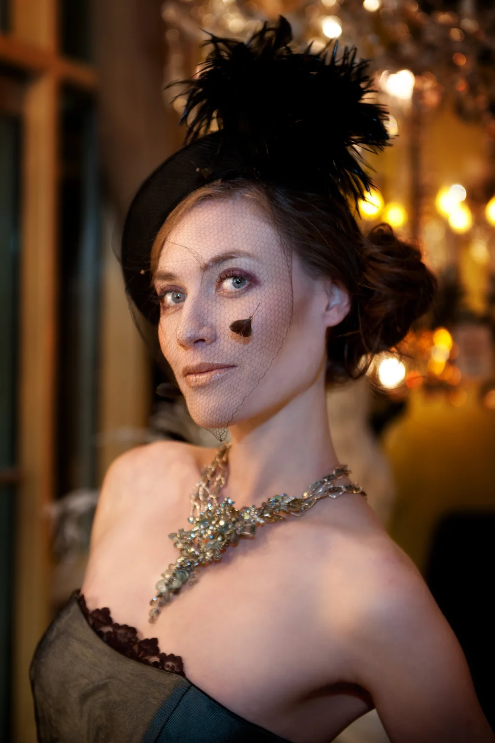 Brunette woman in vintage dress with art necklace