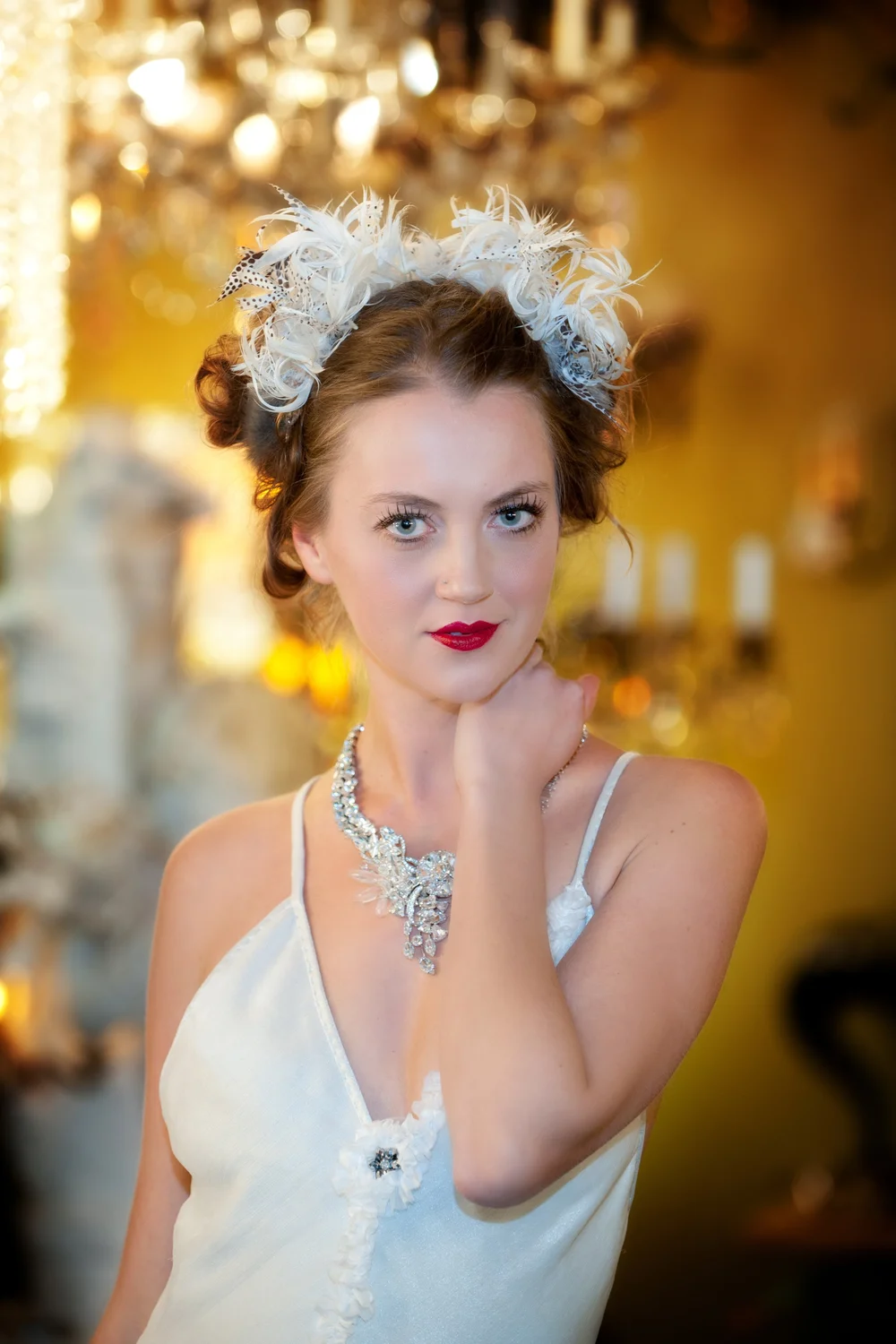 Short haired woman in vintage dress with gold necklace