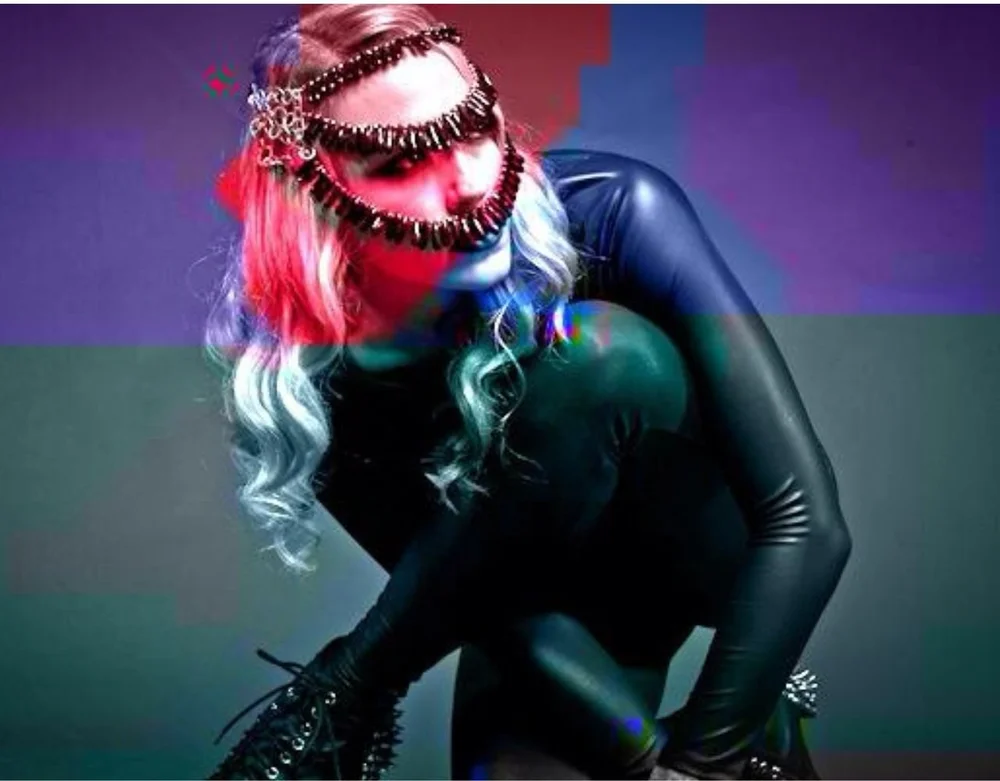 Woman wearing colorful art jewelry under blacklight and digital effects