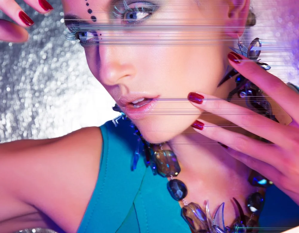 Woman in blue dress and colorful art jewelry and digital effects