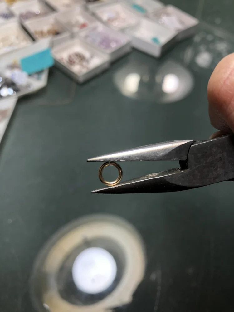 A pair of pliers with bead