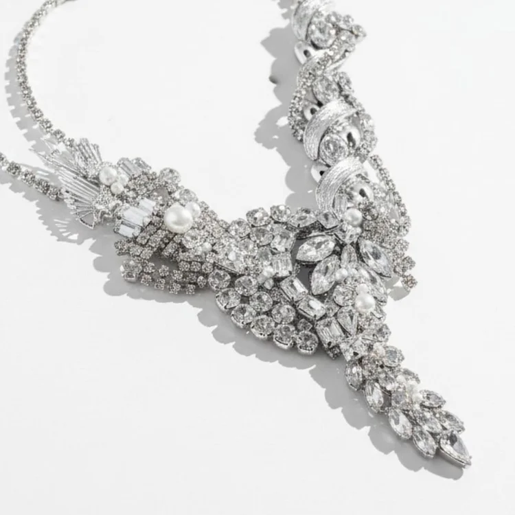 Silver vintage statement necklace with a dense V of clear crystals