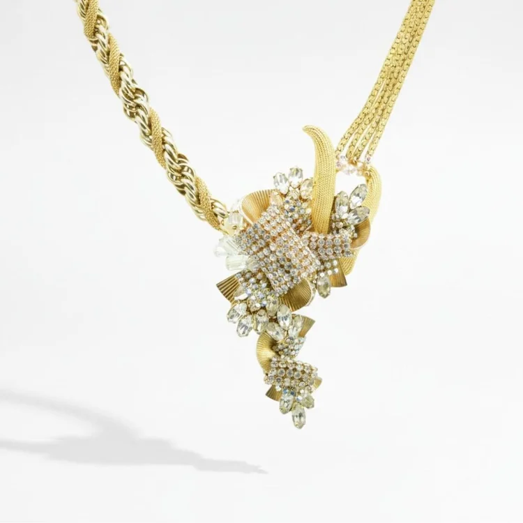 Gold rope chain necklace with a crystal-encrusted cluster drop