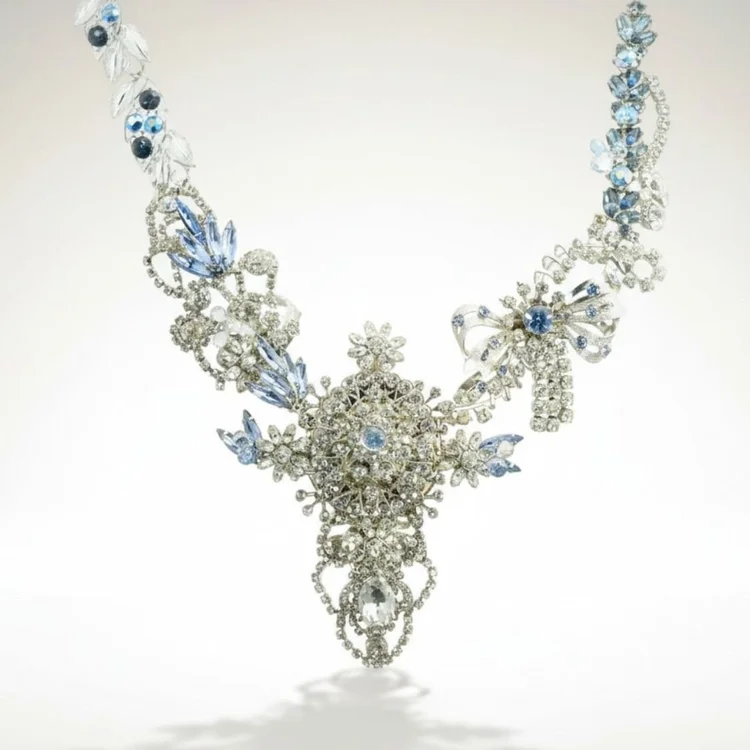 Silver vintage crystal bib necklace with blue stones and an ornate center pendant