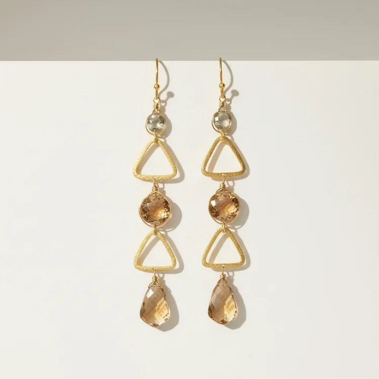 Gold geometric drop earrings with faceted champagne and peach stones