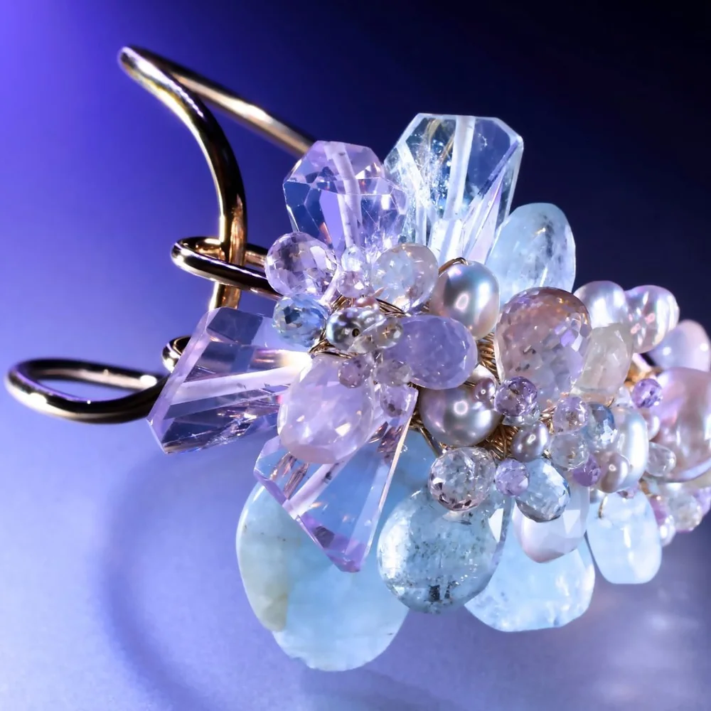 A pastel gemstone cluster bracelet from the Tamar collection by Andrea Li, on purple