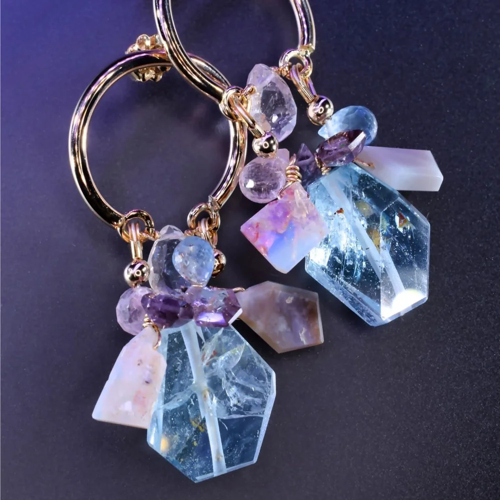 Pastel gemstone cluster earrings from the Tamar collection by Andrea Li, on purple