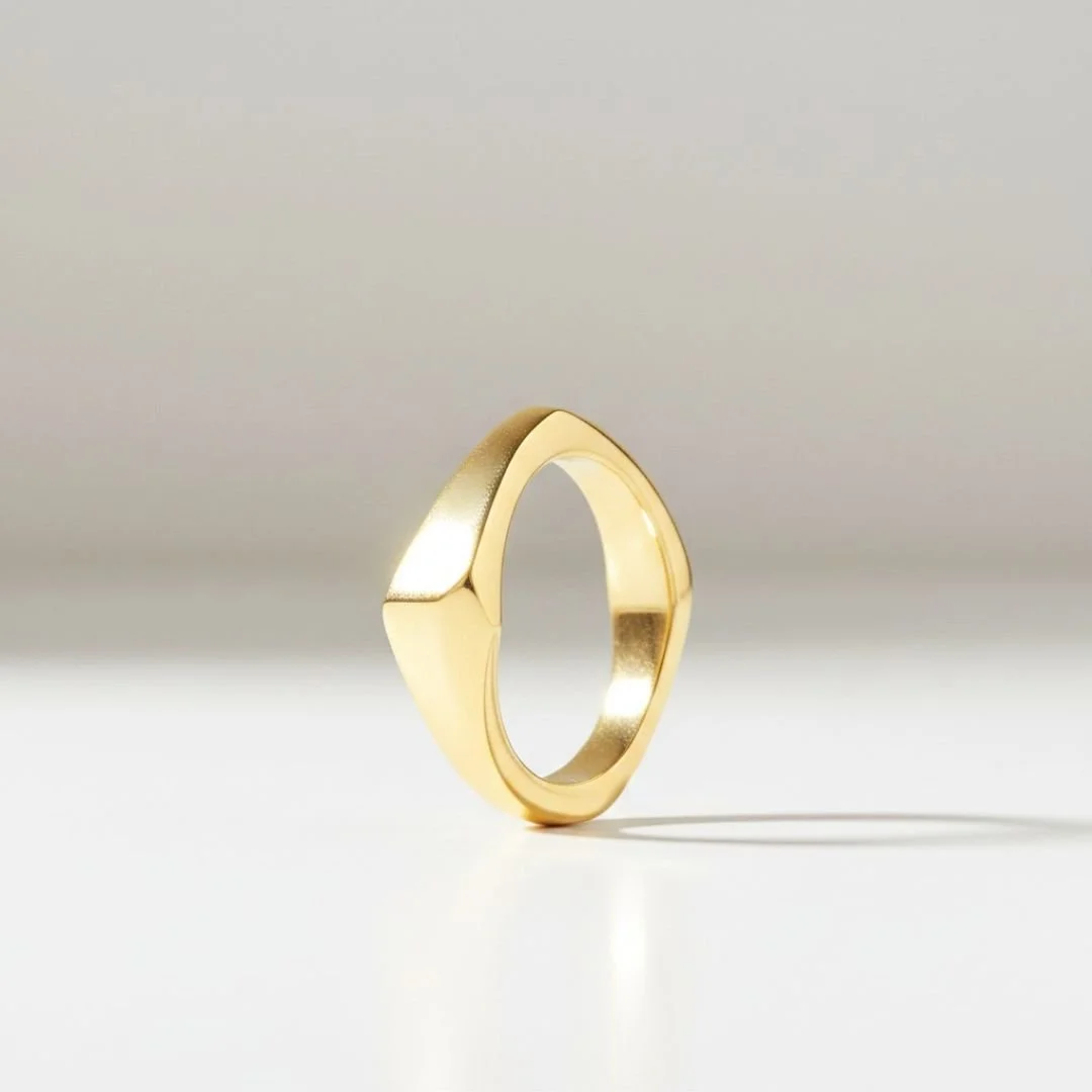 Hand-carved, cast solid 14k gold architectural ring with angular faceted planes.
