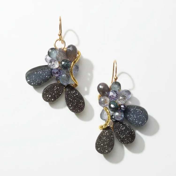 Gold earrings with violet and gray stone clusters over sparkling dark druzy teardrops