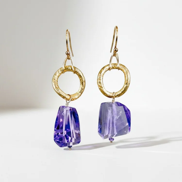 Hammered gold ring earrings with large faceted violet stones