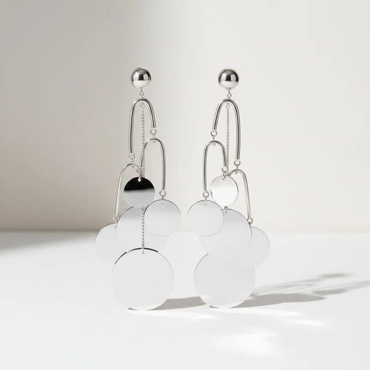Mirror-polished silver earrings of stacked arches and discs