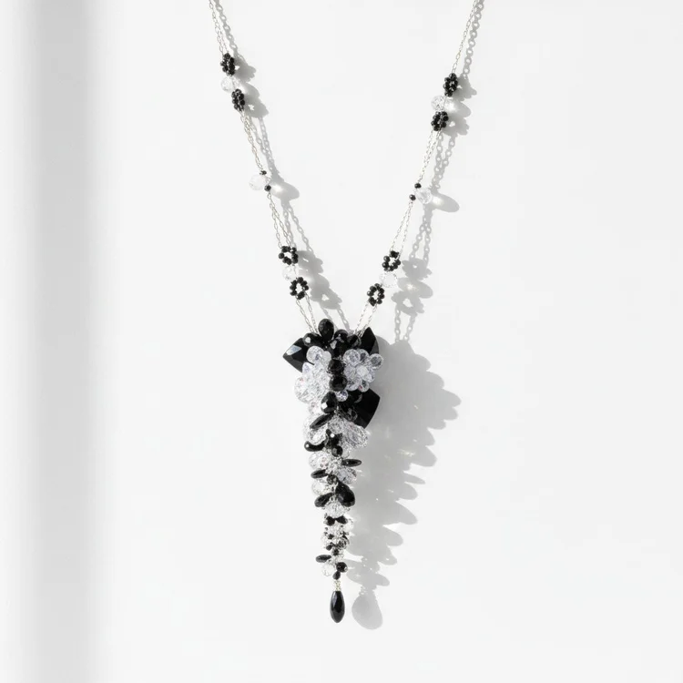 Silver chain necklace with a cascade of black and clear stones