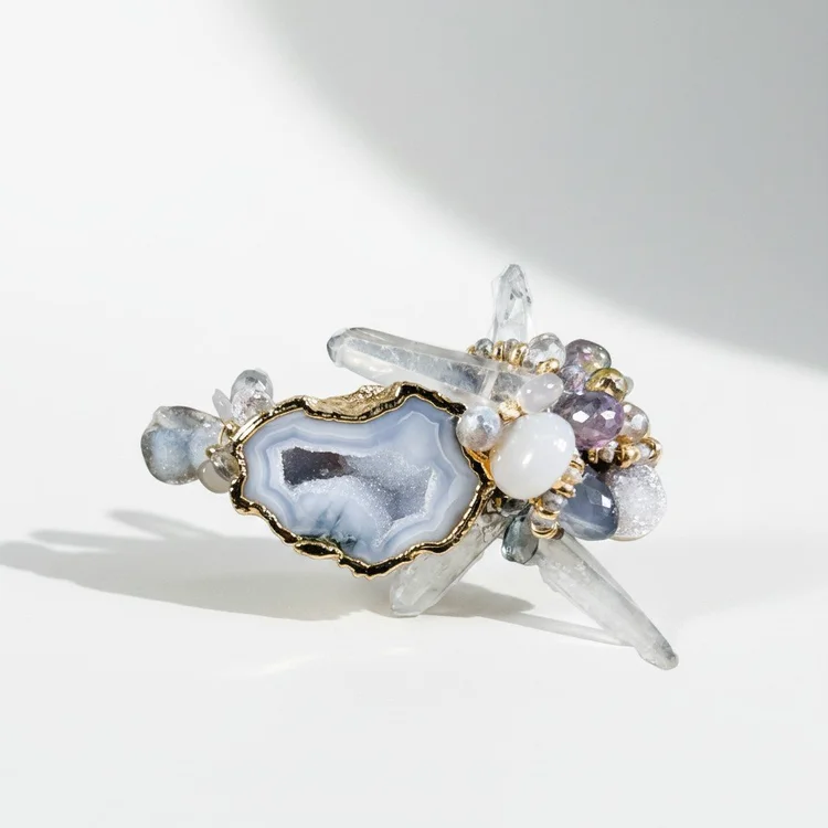 Silver cuff with a blue-gray geode slice, crystal points and lavender pearls