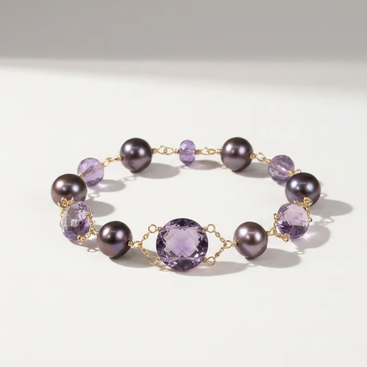 Bracelet of dark purple pearls and faceted lavender stones on gold chain