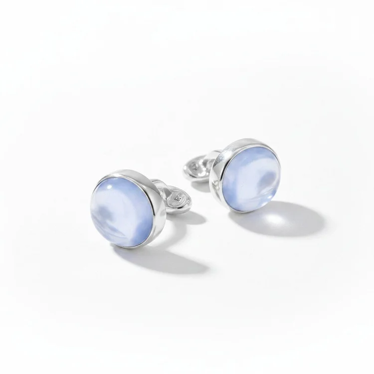 Silver cufflinks with round pale blue cabochons