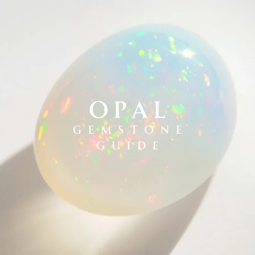 Cover of Andrea Li's Opal Gemstone Guide: a white opal cabochon flashing color