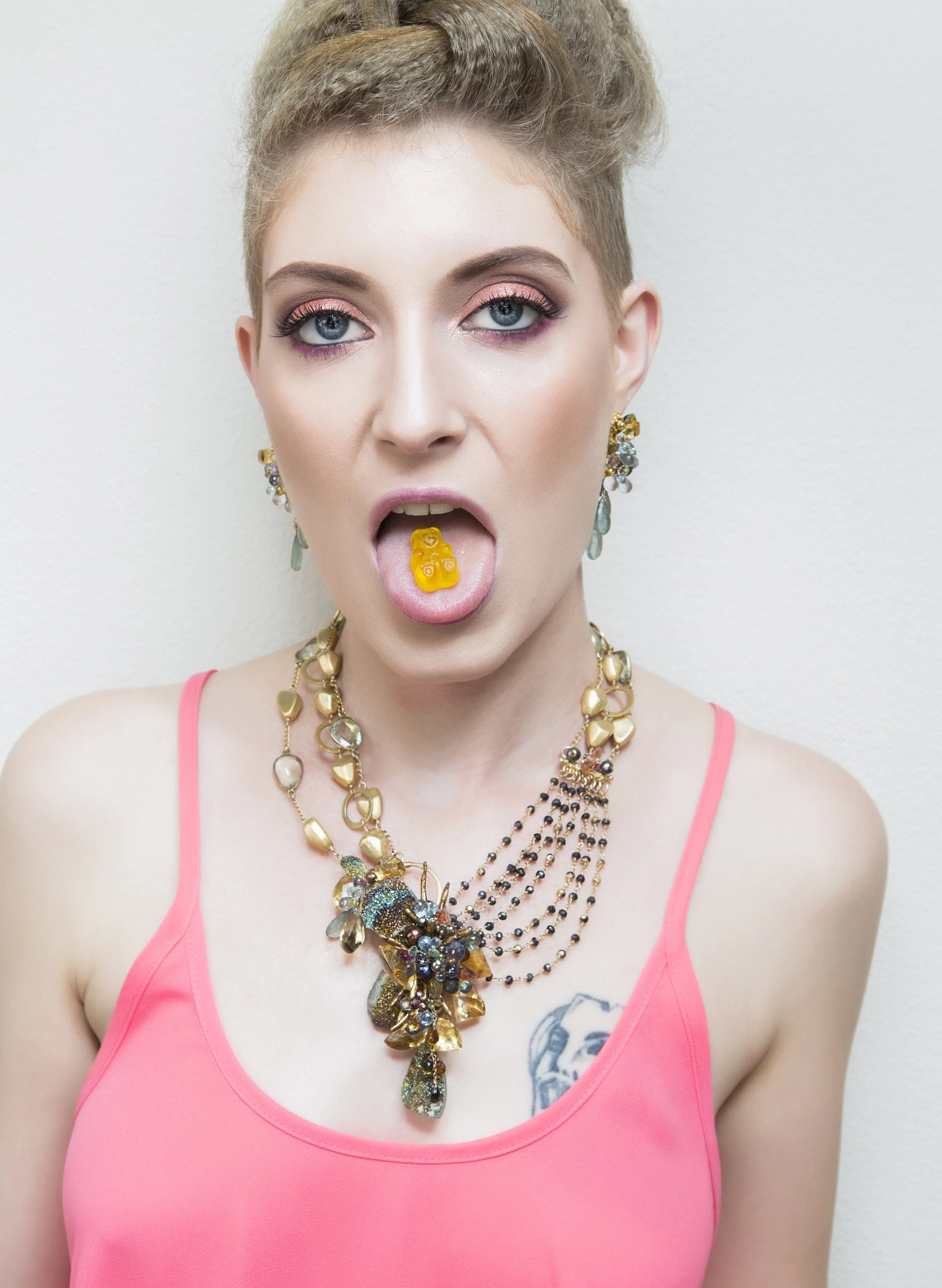 model wearing a colorful gemstone necklace