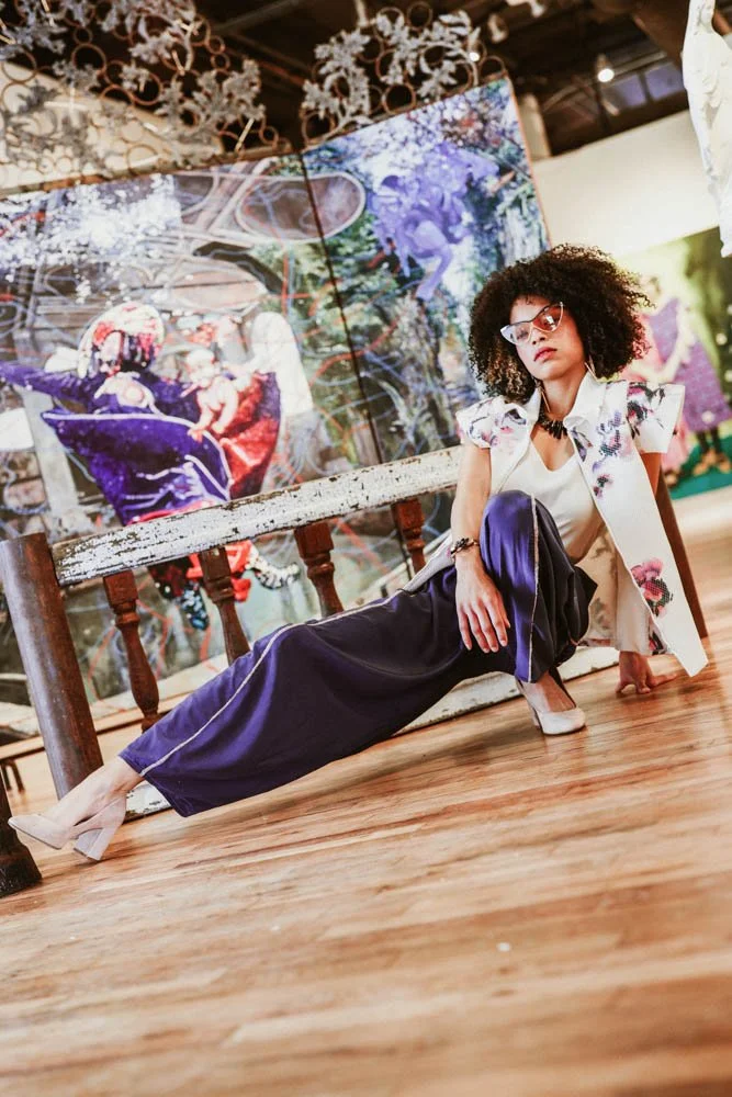 Model in an art gallery for an editorial fashion shoot with tourmaline jewelry