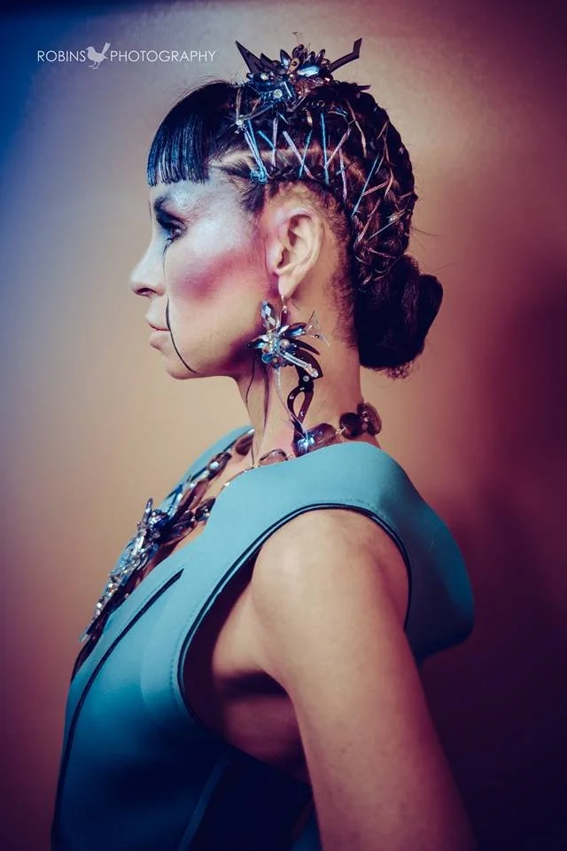 Backstage prepping for the fashion show with statement jewelry models, artists, hair and makeup artists