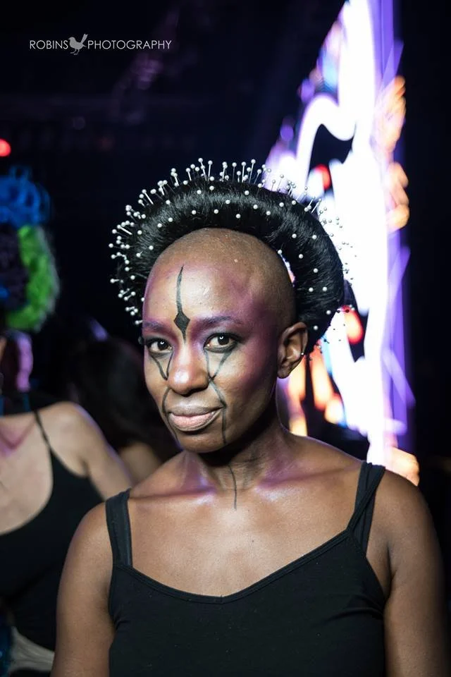 Backstage prepping for the fashion show with statement jewelry models, artists, hair and makeup artists