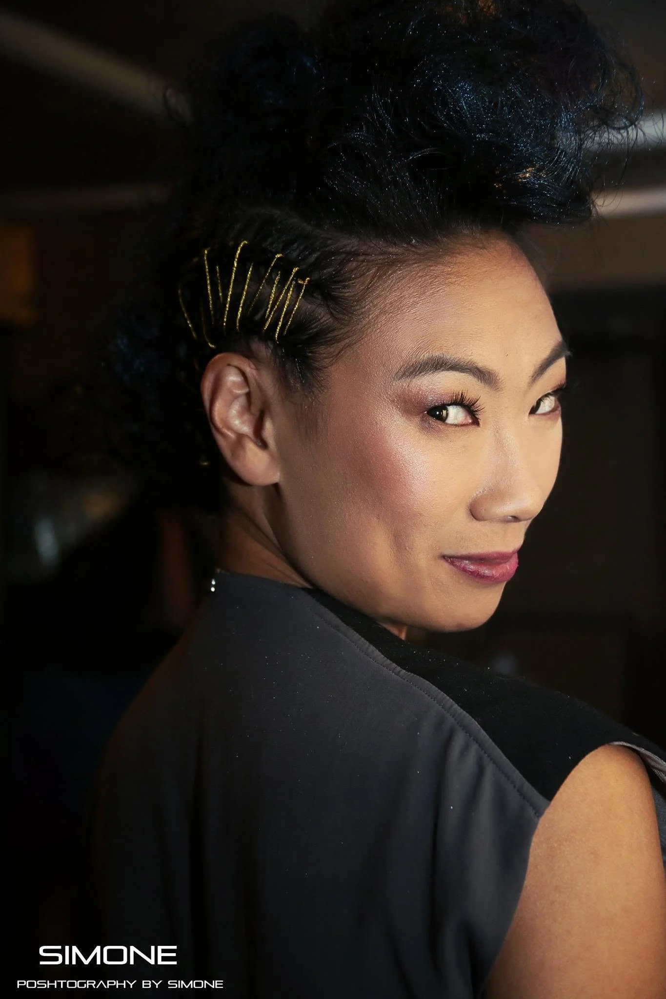 Backstage prepping for the fashion show with statement jewelry models, artists, hair and makeup artists