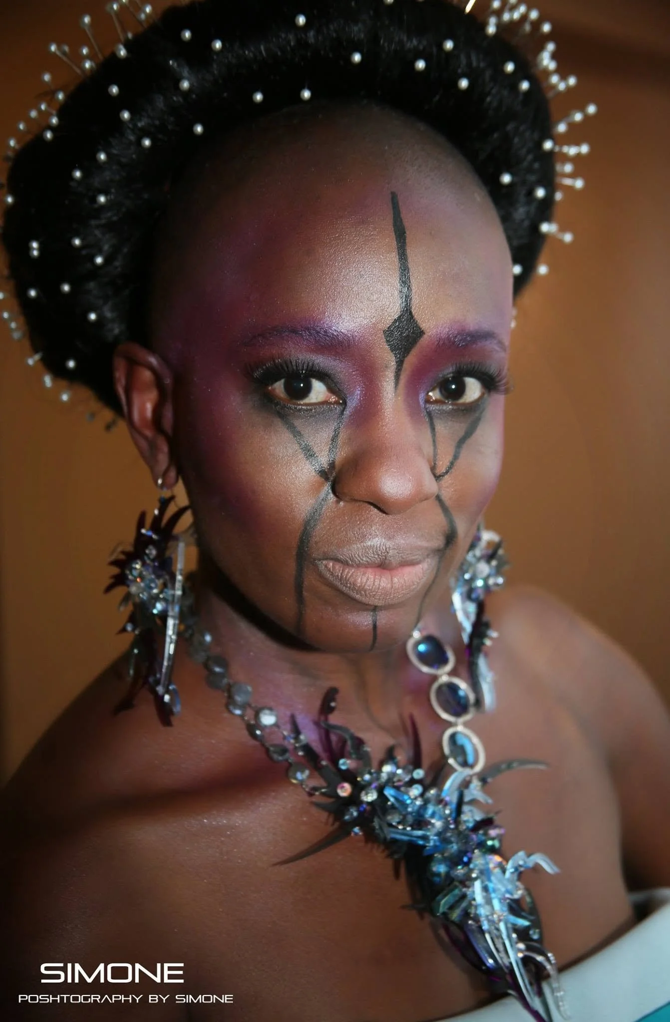 Backstage prepping for the fashion show with statement jewelry models, artists, hair and makeup artists