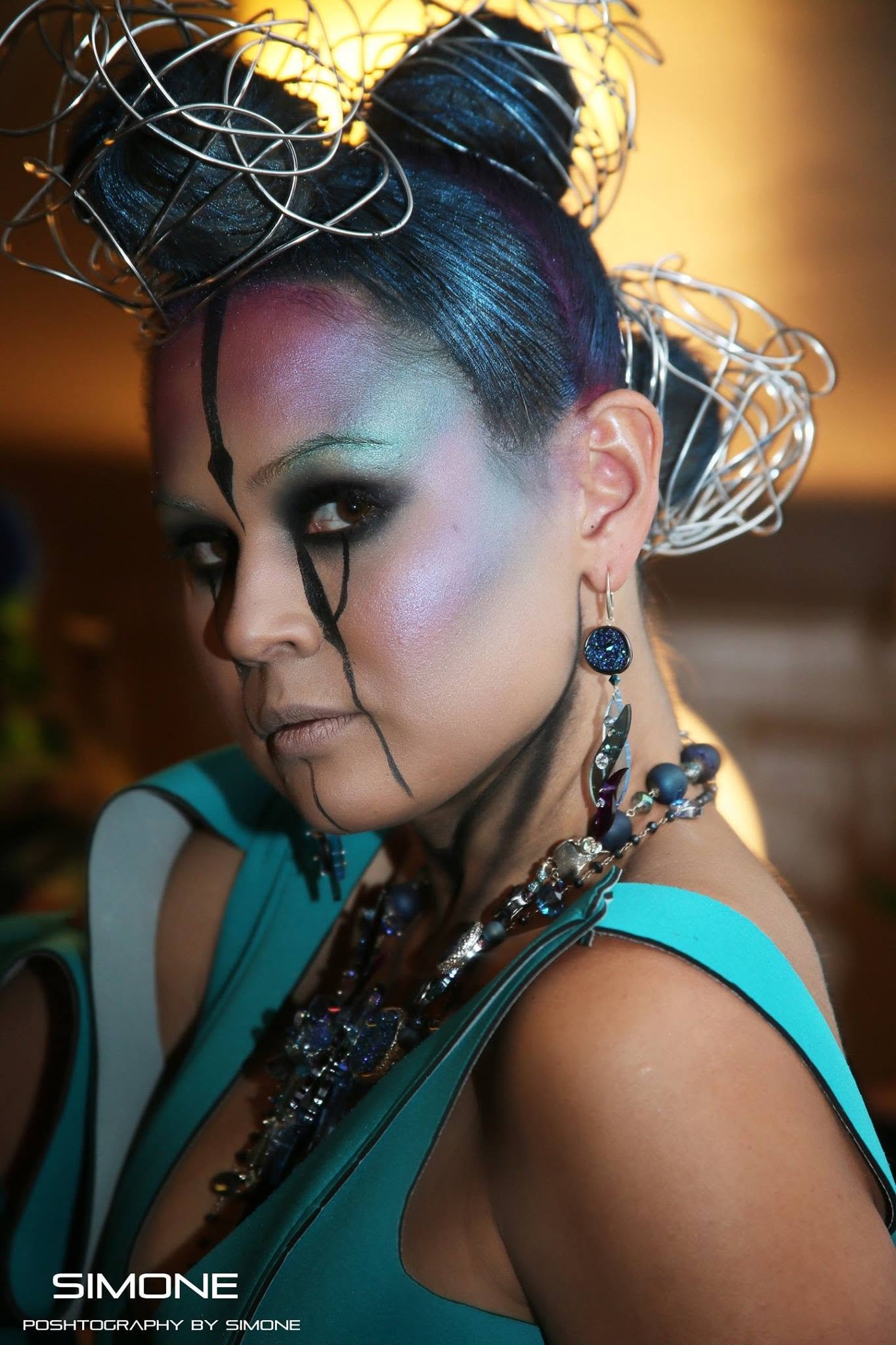 Backstage prepping for the fashion show with statement jewelry models, artists, hair and makeup artists