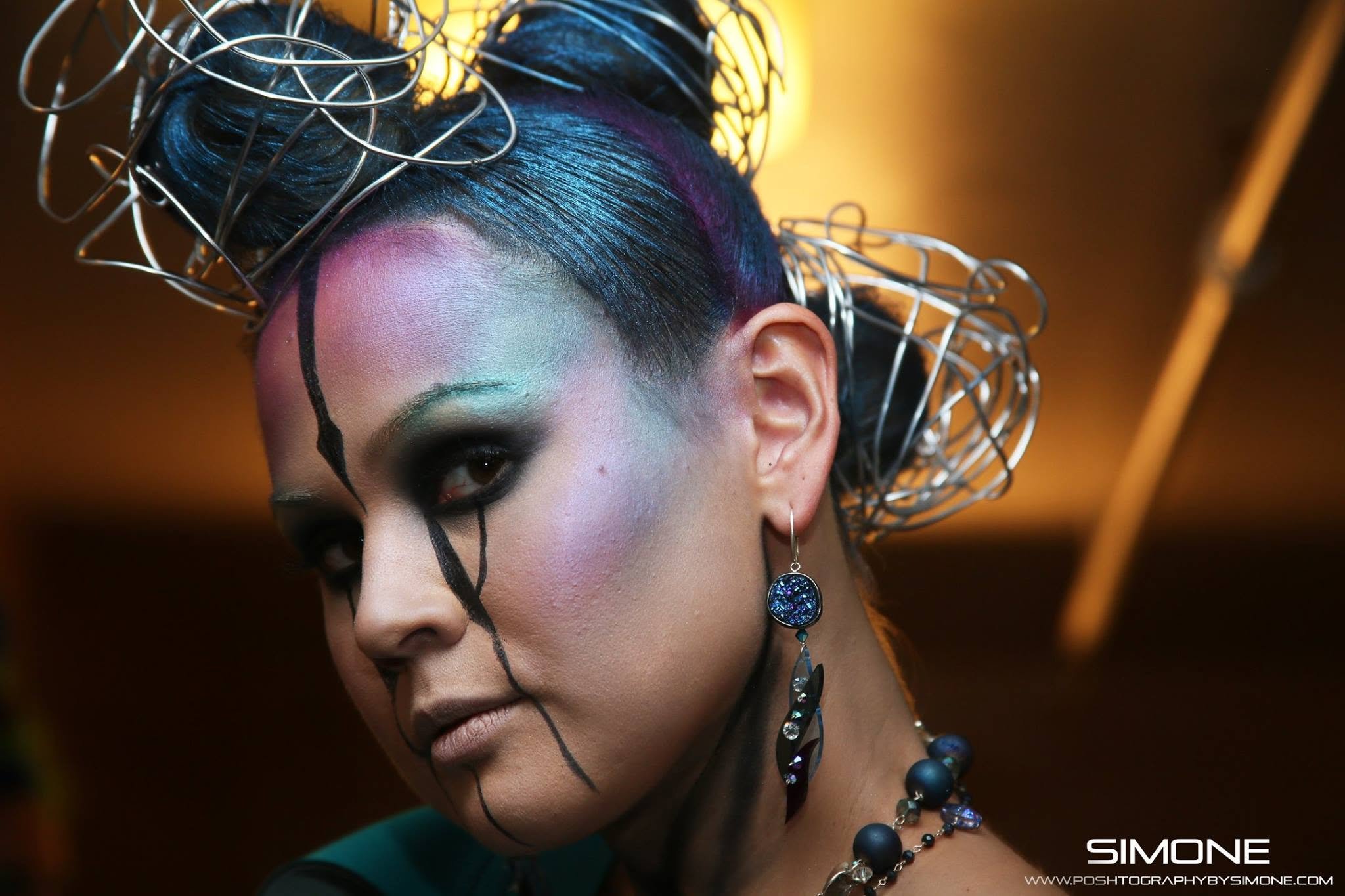 Backstage prepping for the fashion show with statement jewelry models, artists, hair and makeup artists