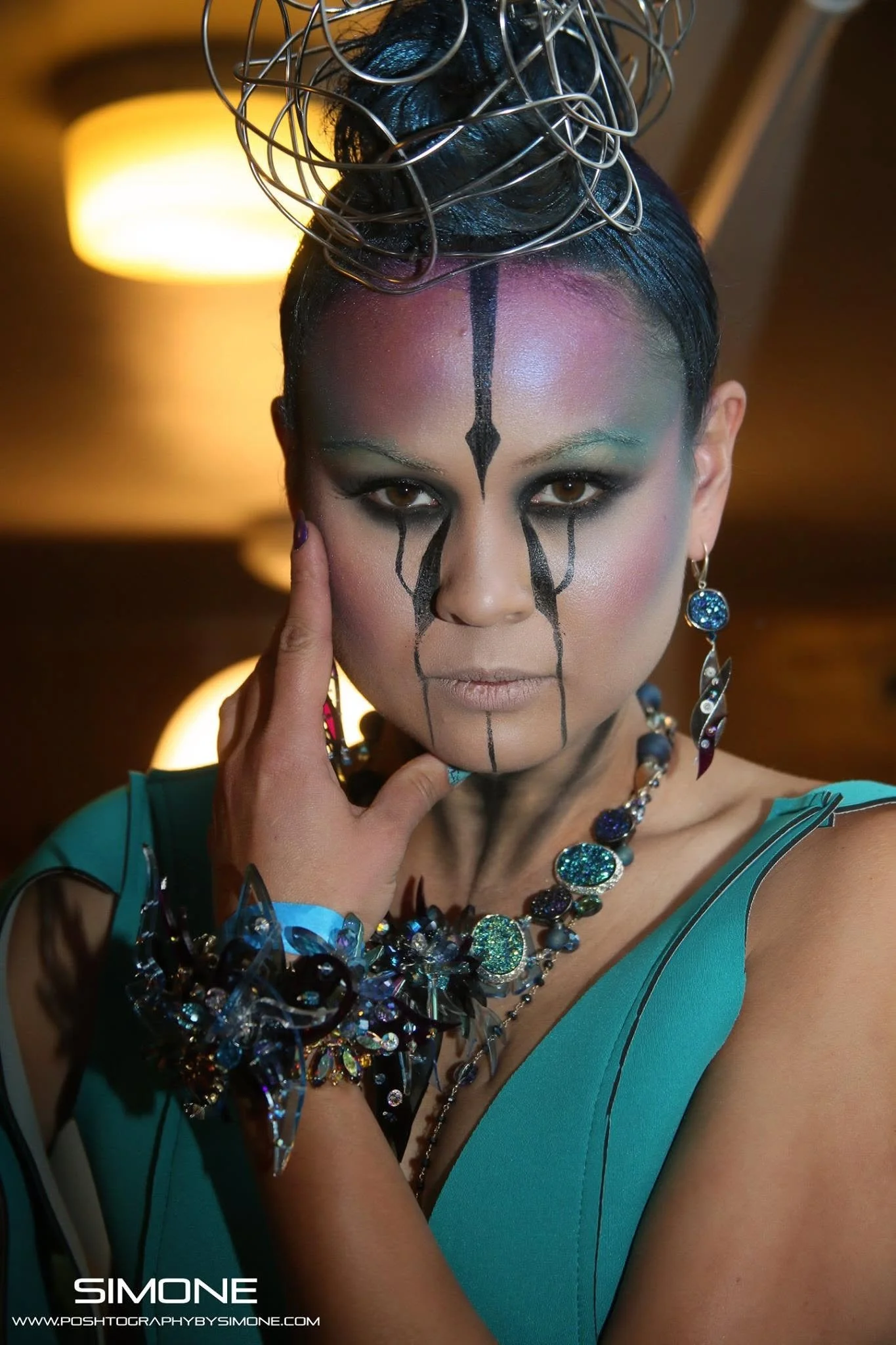 Backstage prepping for the fashion show with statement jewelry models, artists, hair and makeup artists