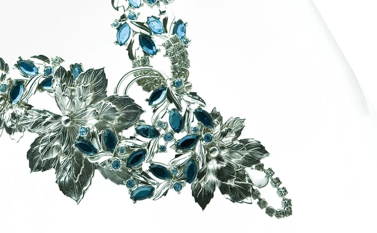 Detail of silver leaf castings and blue navette crystal