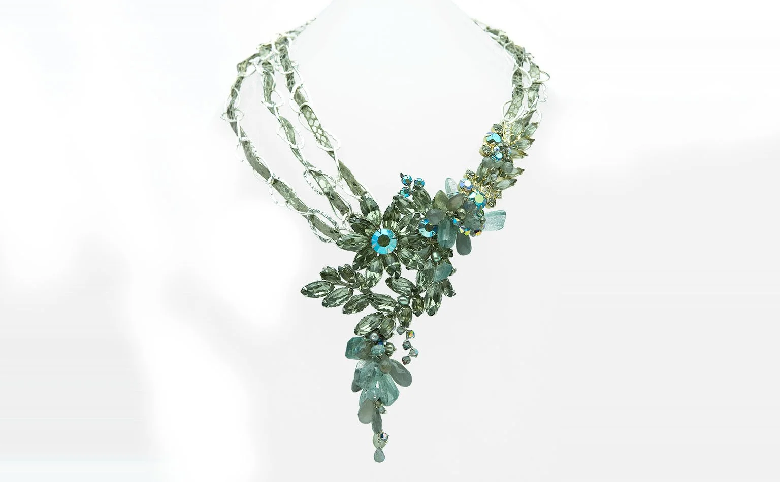 Smoky grey crystal necklace with a multi-strand front and drop 