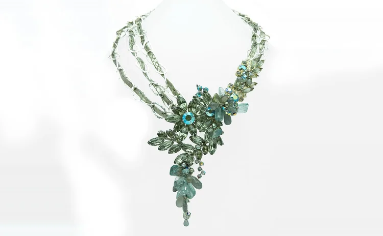 Smoky gray crystal necklace with a multi-strand front and drop