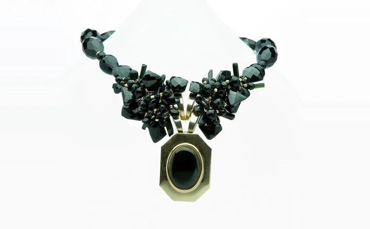 Black crystal necklace centered on a large oval cabochon pendant