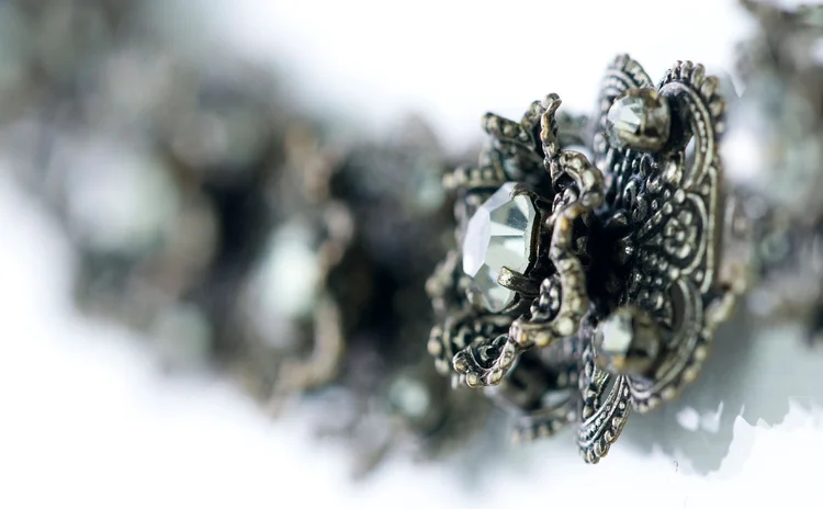 Detail of marcasite filigree set with clear crystal and pearl