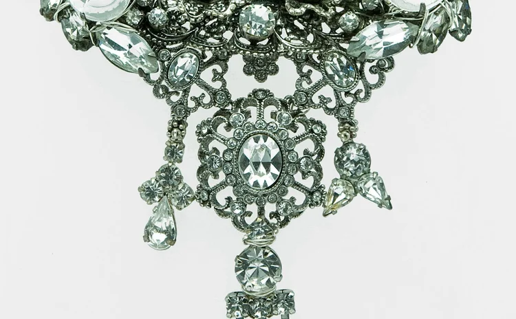 Clear rhinestone pendant with a filigree drop and crystal fringe