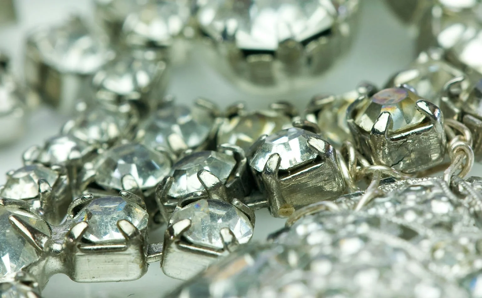 Detail of square-cut crystals in raised claw settings 