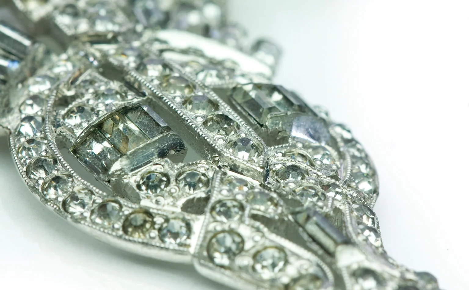 Detail of a pave rhinestone navette in a silver-tone setting